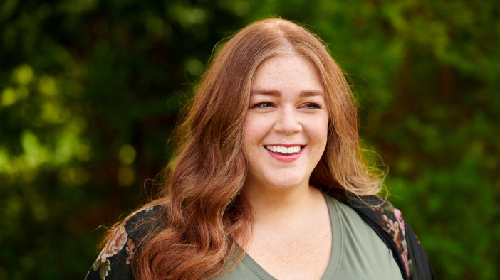 Alicia smiling and looking at the view